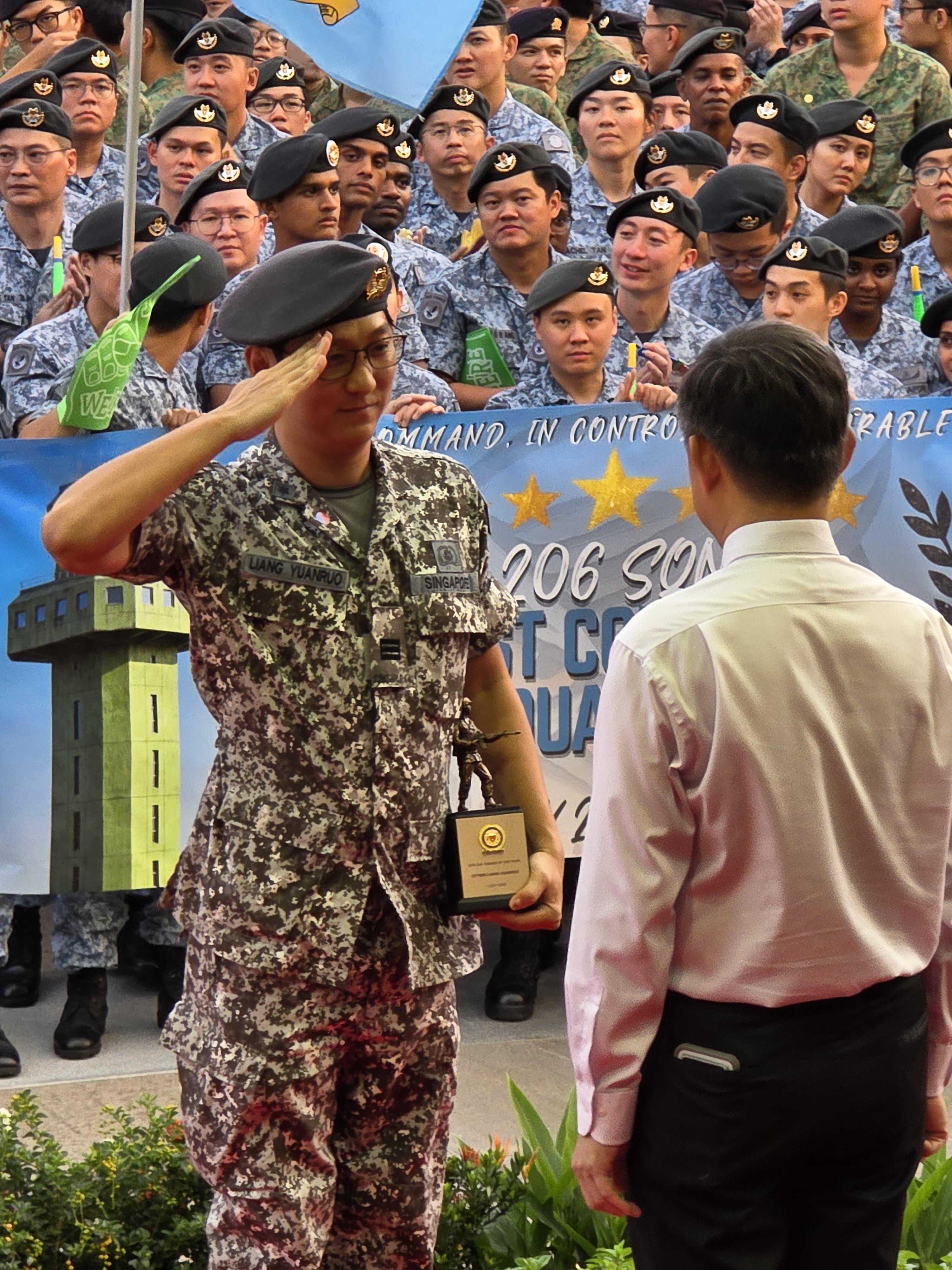 CPT (NS) Liang Yuanruo receiving his award on SAF Day